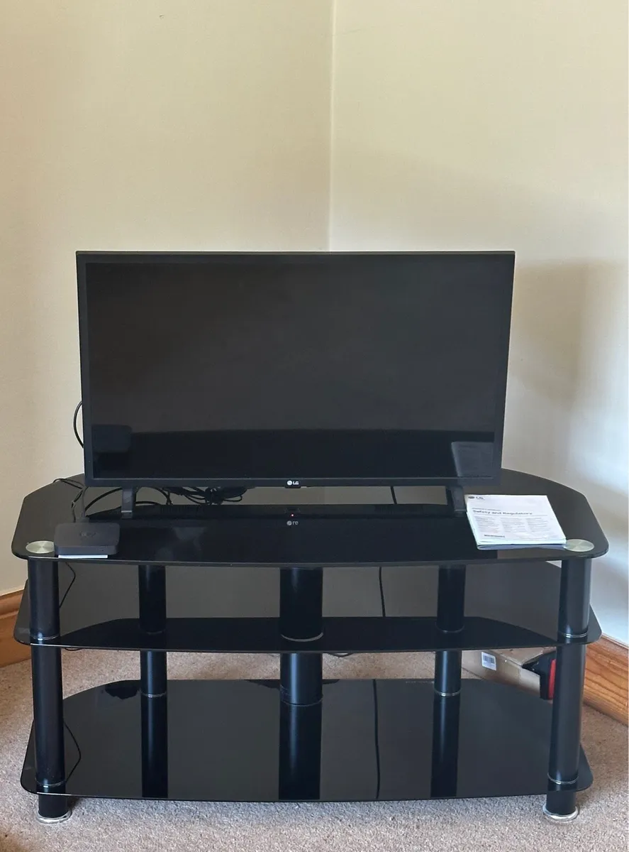 32” LG Smart TV + Glass TV Stand - Image 1
