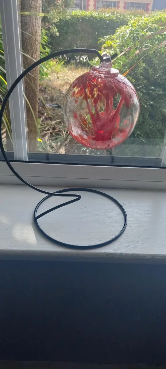 Stunning glass blown ball on black stand - Image 1