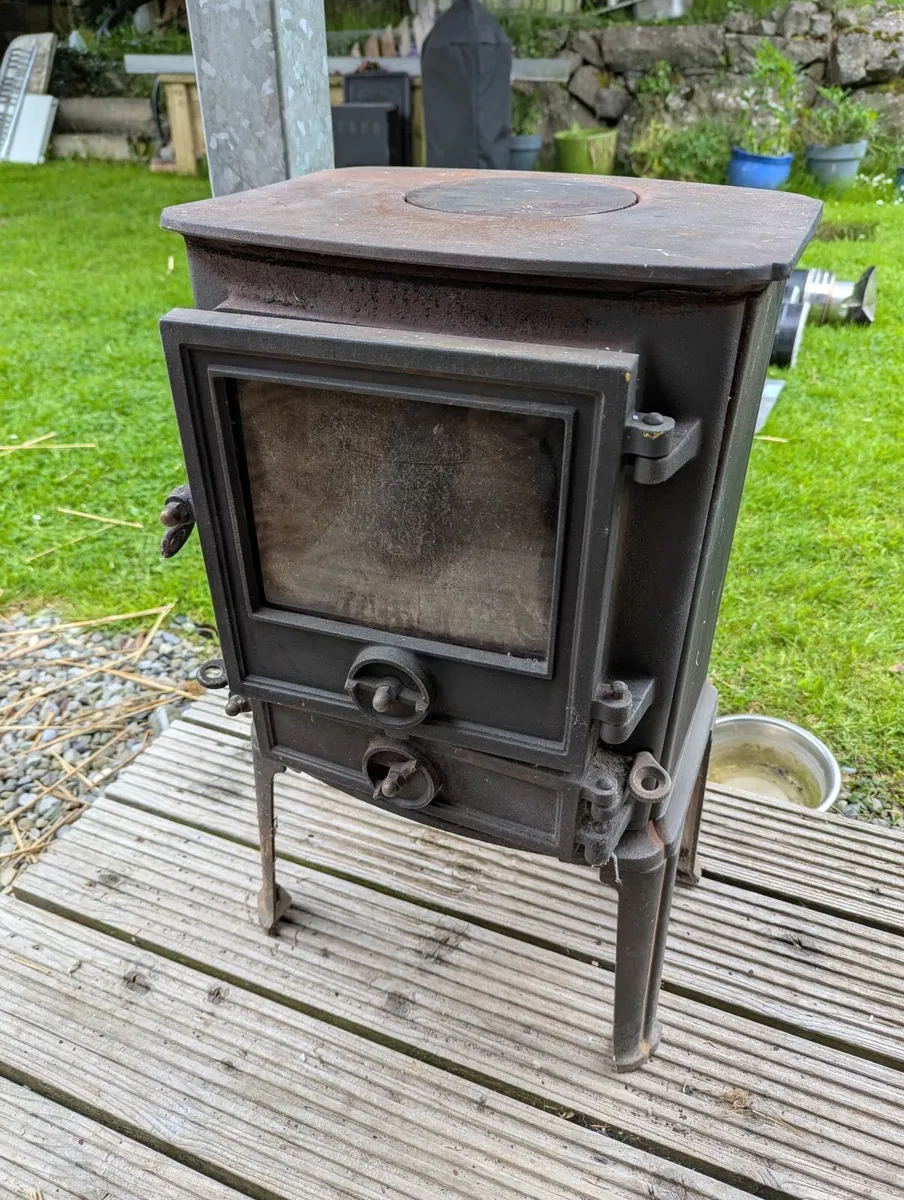 Cast iron stove with backboiler and chimney pipe - Image 1
