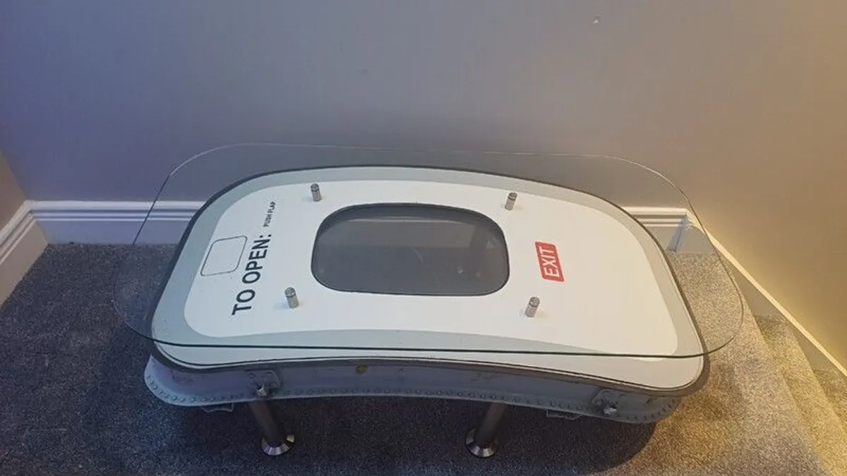 Coffee Table Crafted from an Upcycled ATR 72 Aircraft Emergency Exit Door - Image 1
