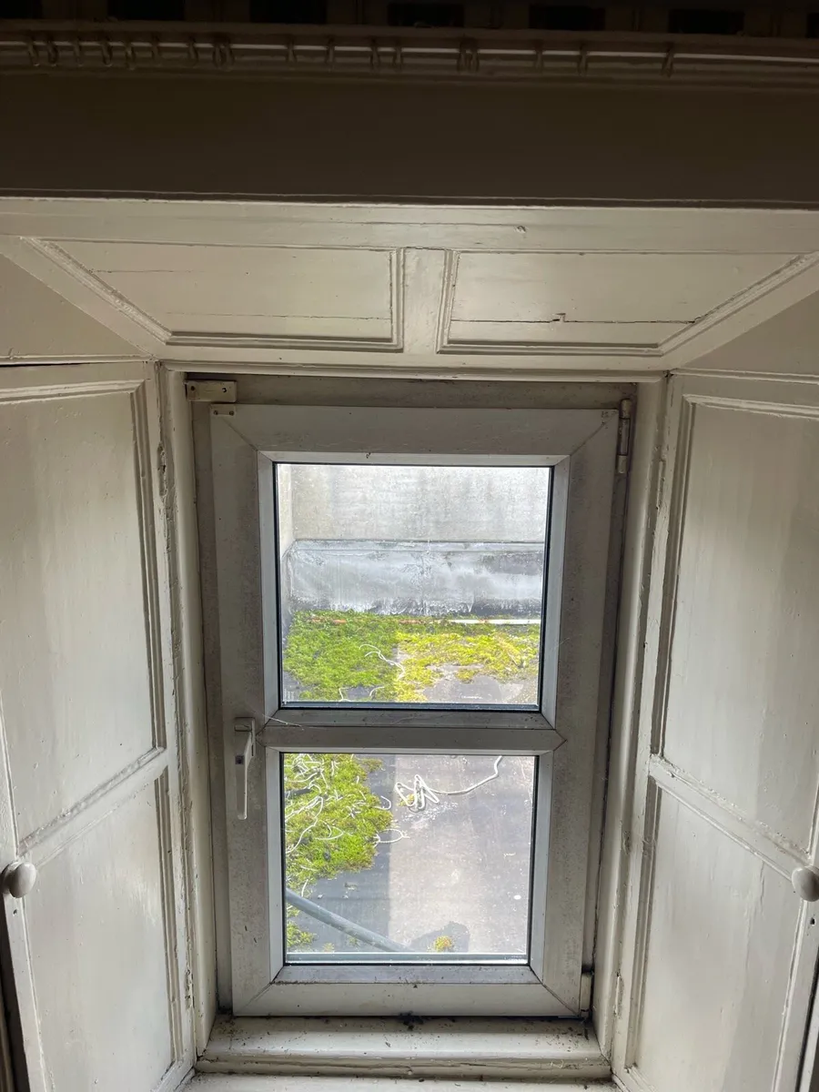 4  antique wooden shutters and architrave