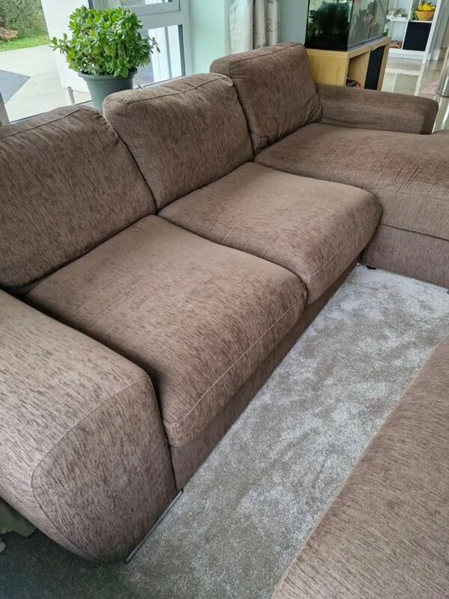 LShaped sofa with pouffe round table four stools - Image 4