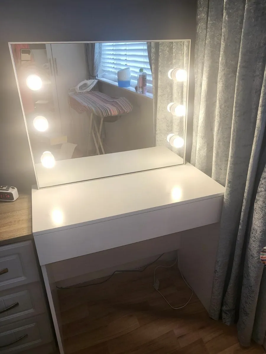 A vanity table with light's - Image 1