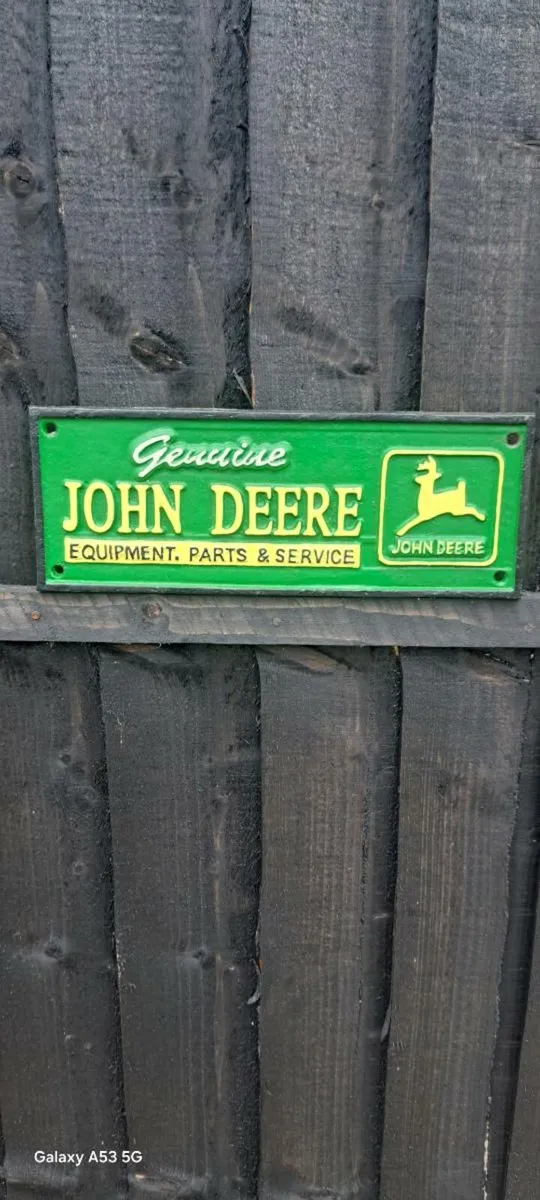 John deer services cast iron sign