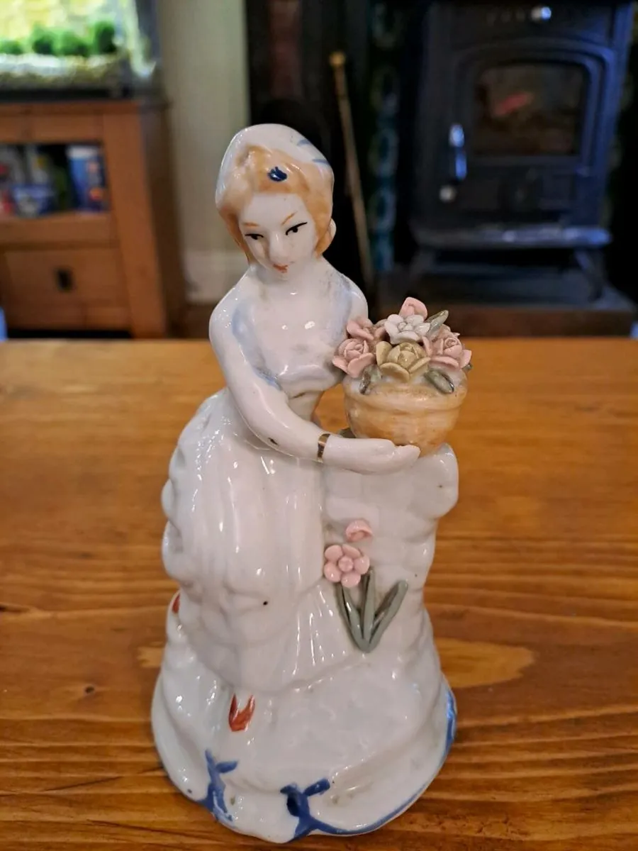 Vintage woman porcelain figurine detailed flowers - Image 1