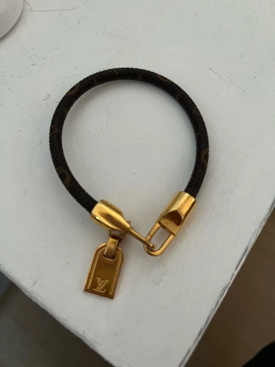 Louis Vuitton monogram bracelet with tag charm - Image 1