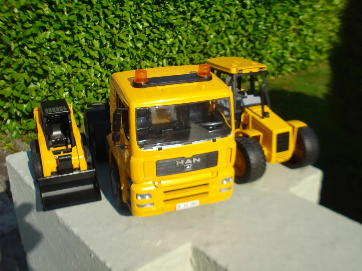 BRUDER JCB 4CX, CAT SKID & MAN PRIME MOVER CAB. - Image 1