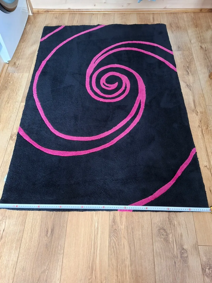 Black and pink rug - Image 1