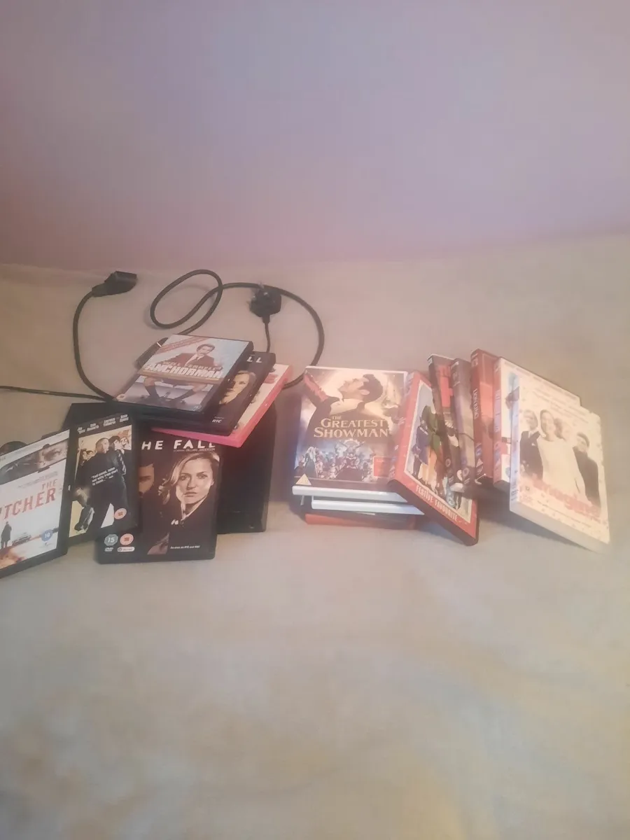 DVD player and DVDs to choose from - Image 1