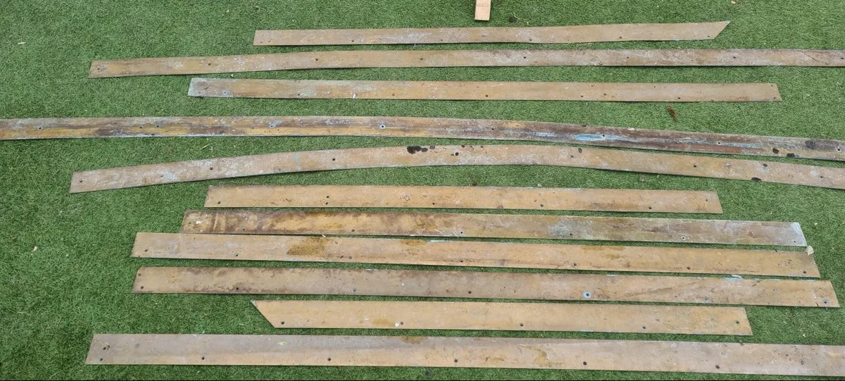 11 strips of Brass Stap like strips.