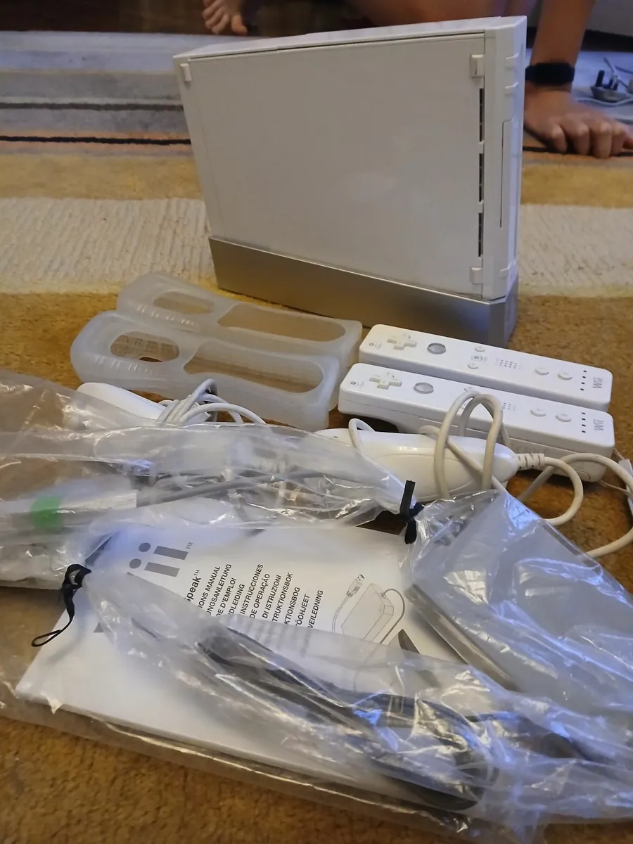WII console and cables plus controllers and WII sp - Image 1