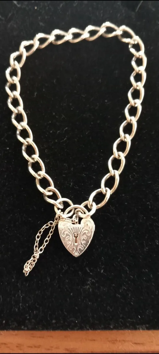 A vintage sterling silver charm bracelet 1980