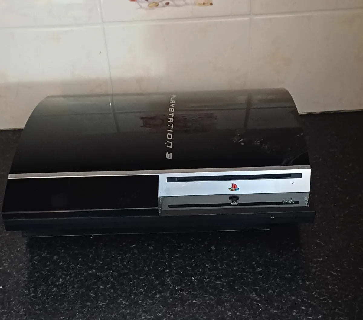 Playstation 3 with 5 controlls and 4 games - Image 1