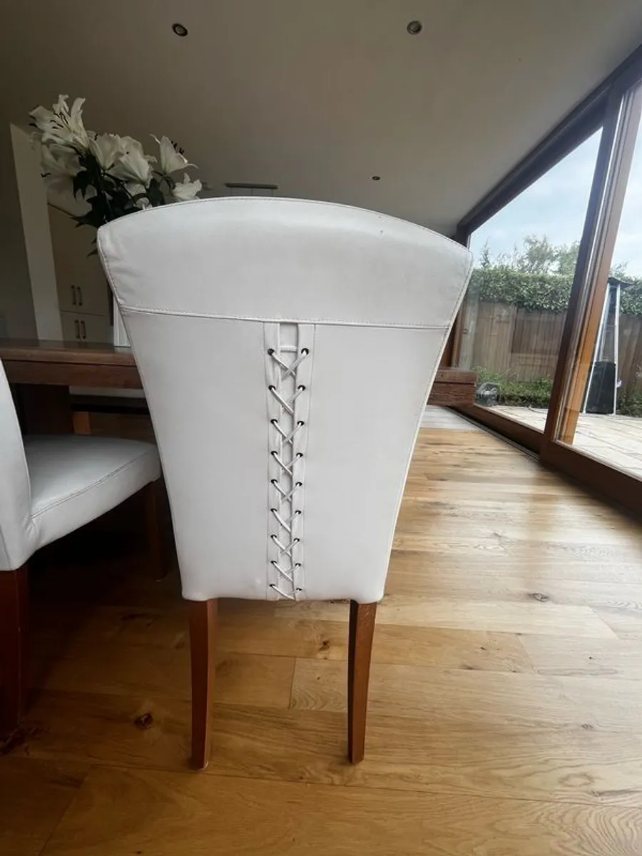 6 white leather + walnut leg chairs; criss-cross stitching on back - Image 1