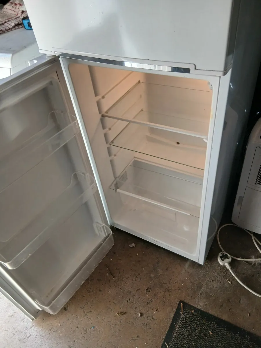 Small fridge freezer by servis 48cm wide x128cm hi - Image 1