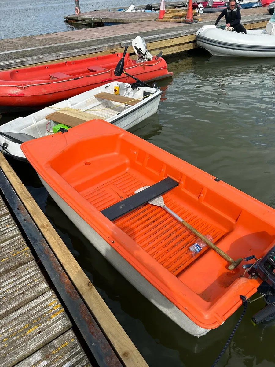 8 ft punt plastic 2hp Honda - Image 1
