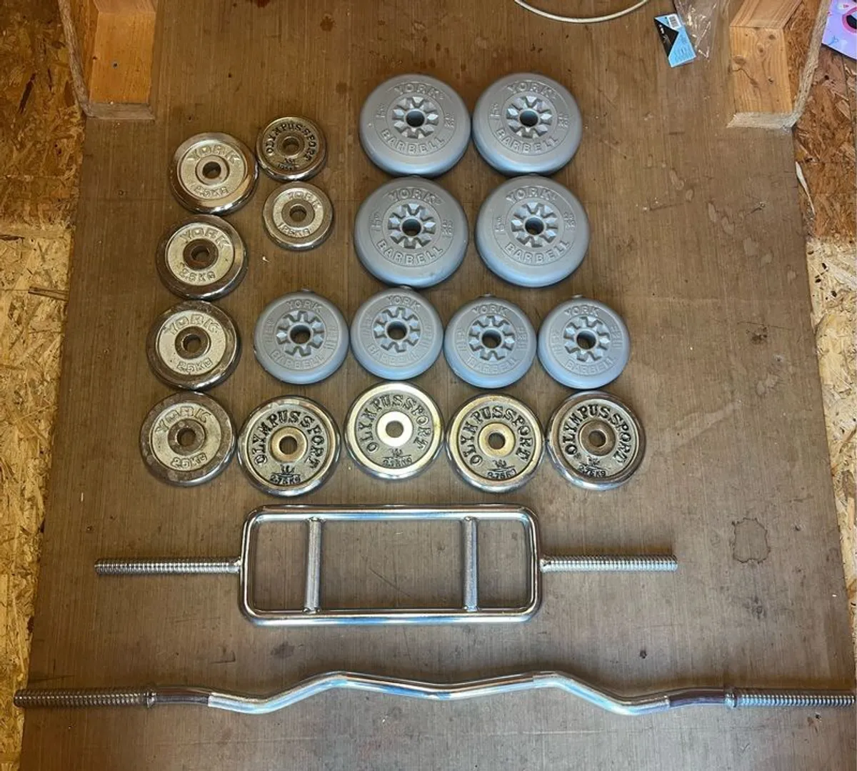 Assorted weights & barbells