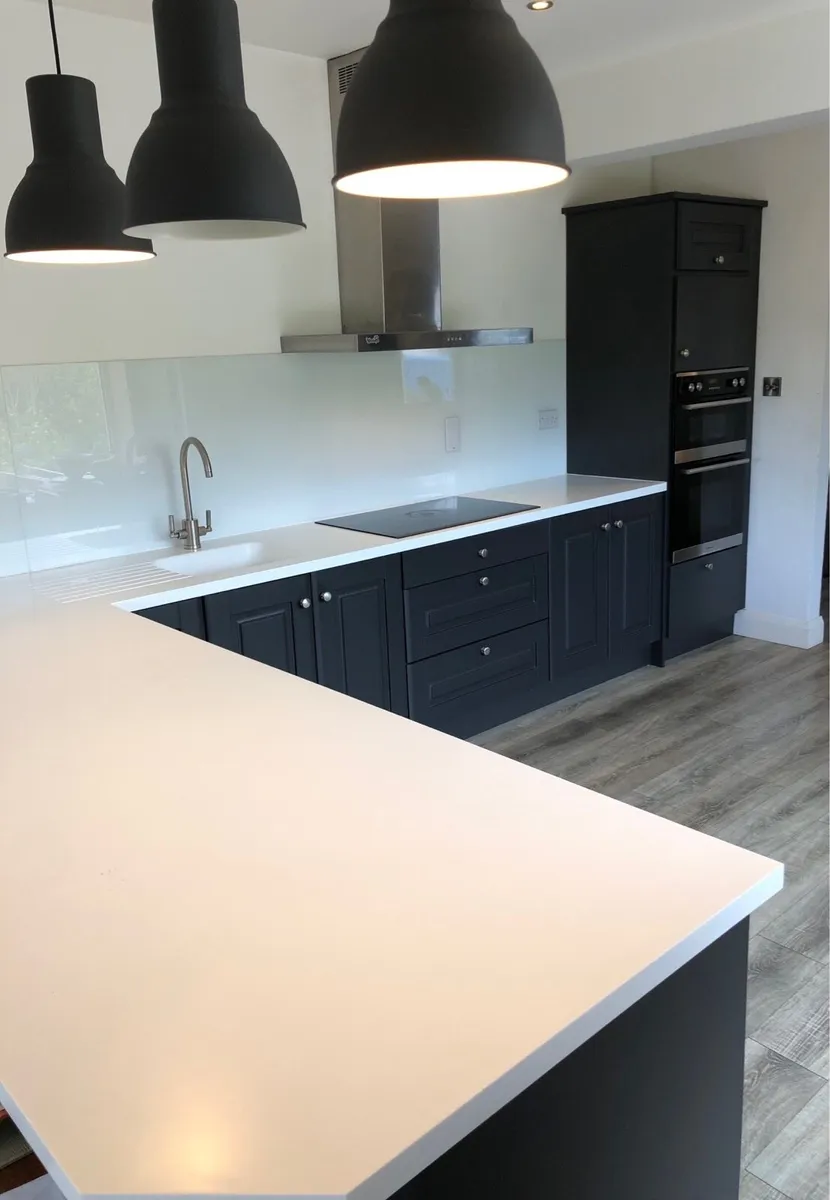 Kitchen , Appliances with Corian worktop . - Image 1