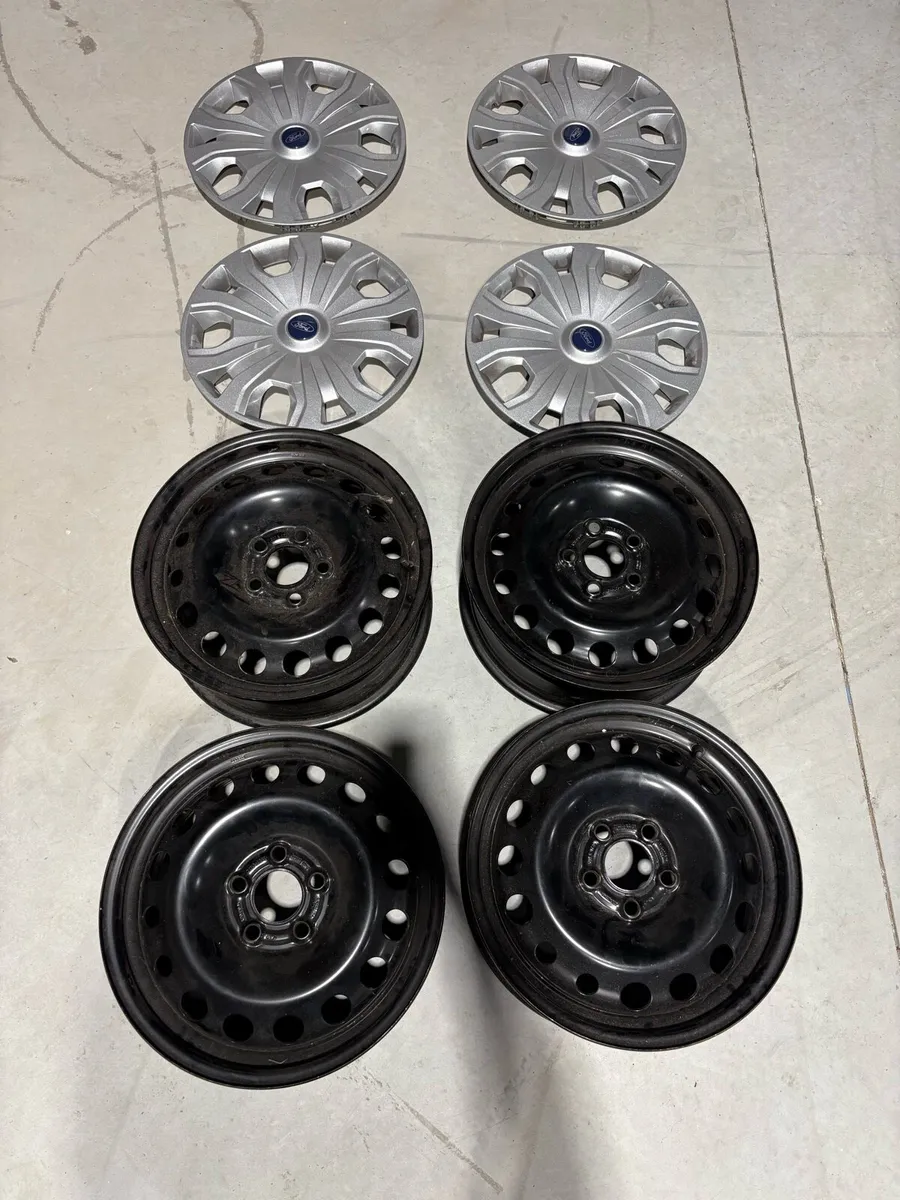 New Ford steel wheels and hub caps - Image 1