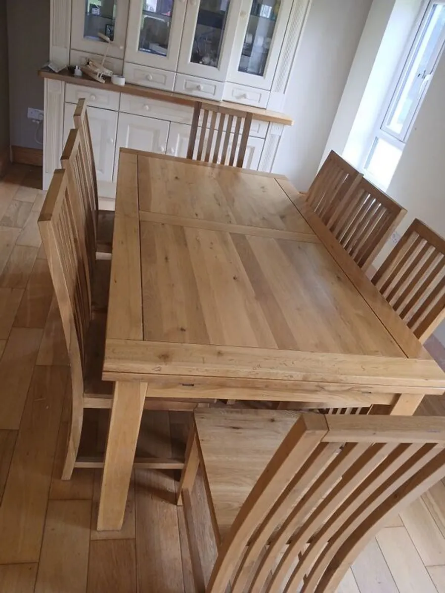 Solid oak dining table and 8 chairs. Very good condition - Image 1