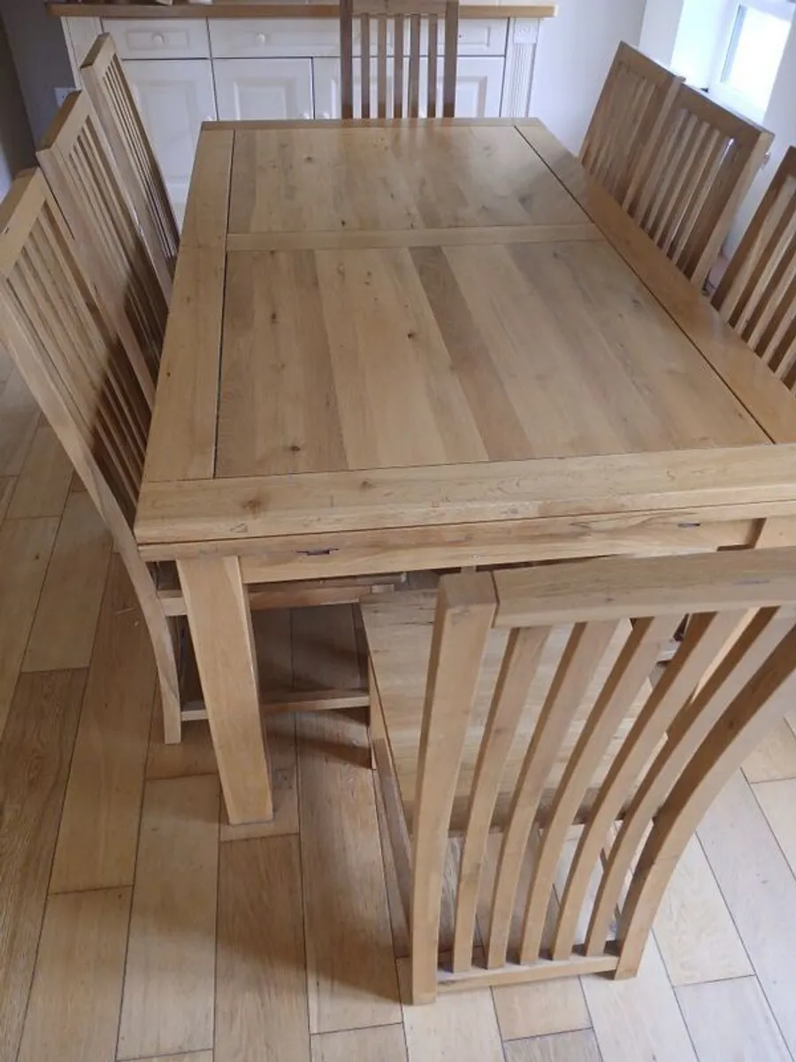 Solid oak dining table and 8 chairs. Very good condition - Image 2