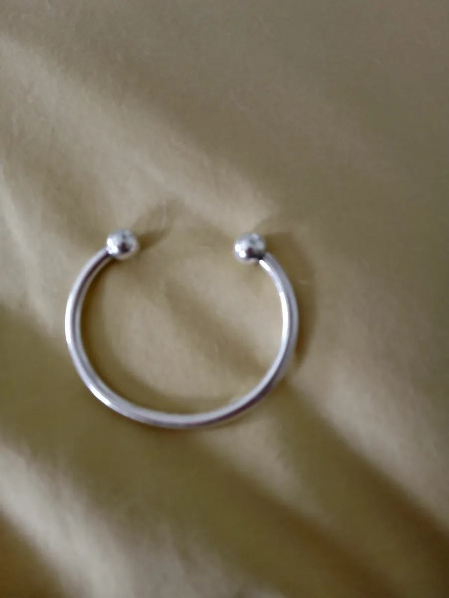 Women's silver torc bracelet - Image 1