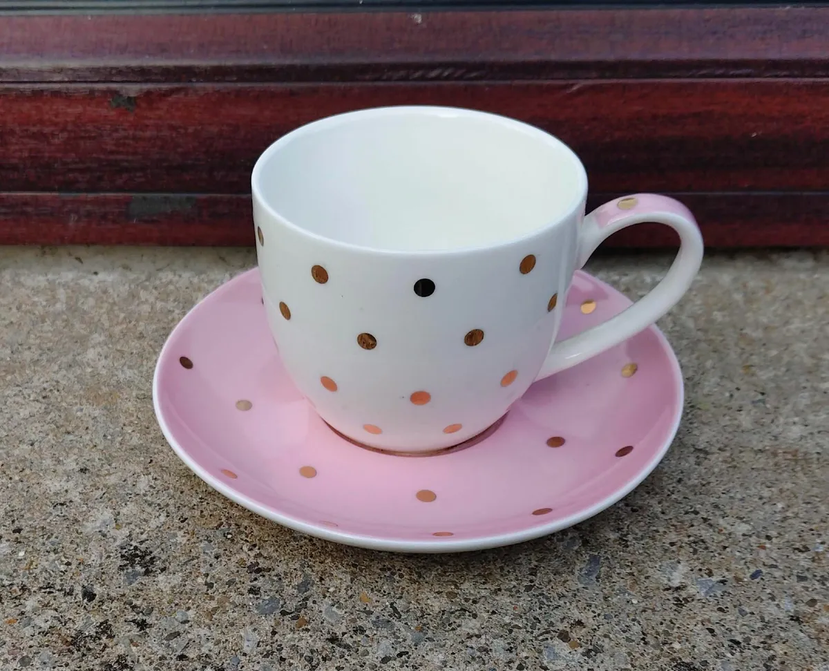 FUN GLUED CUP & SAUCER SET (USED). - Image 1