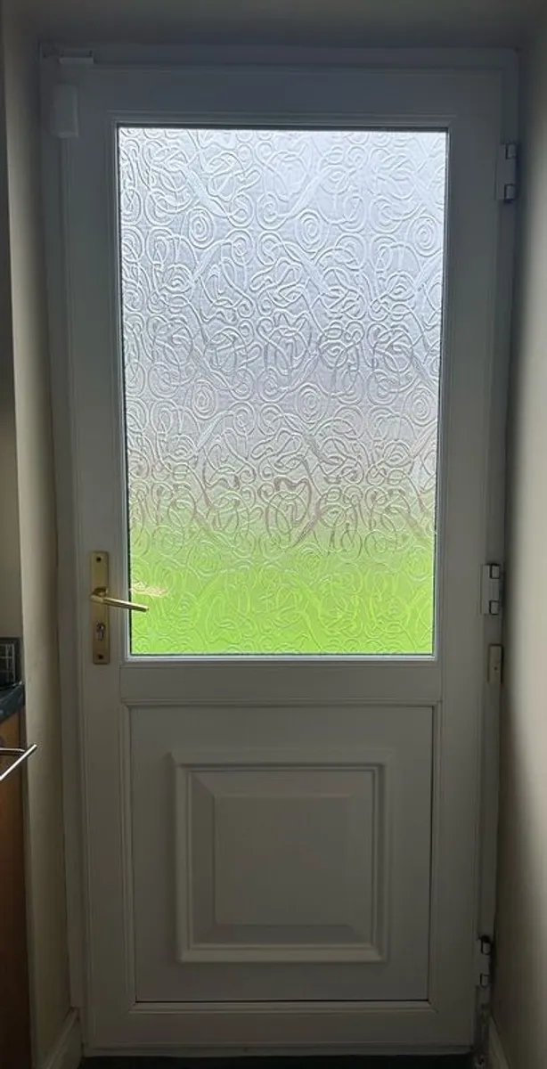 White PVC door with double-glazed window in excellent condition