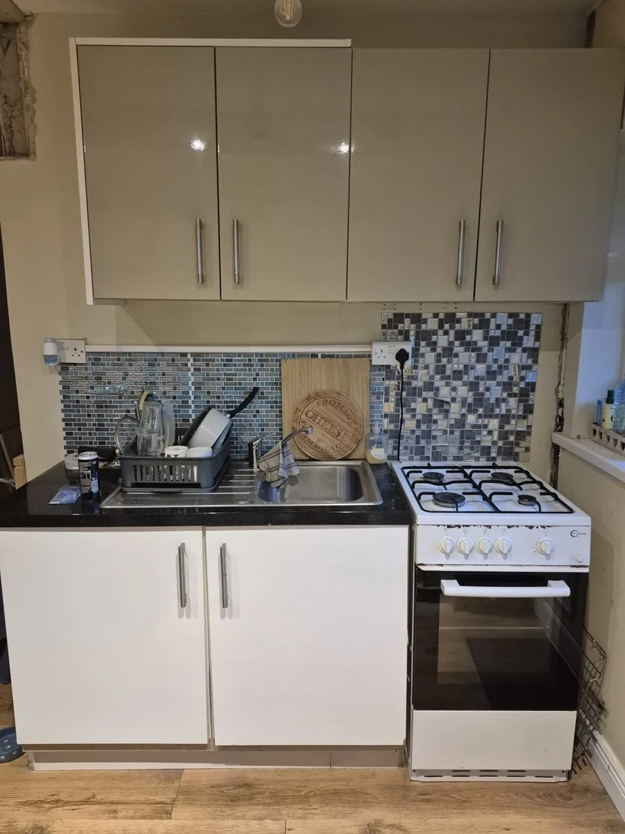 Small kitchen unit with sink and tap