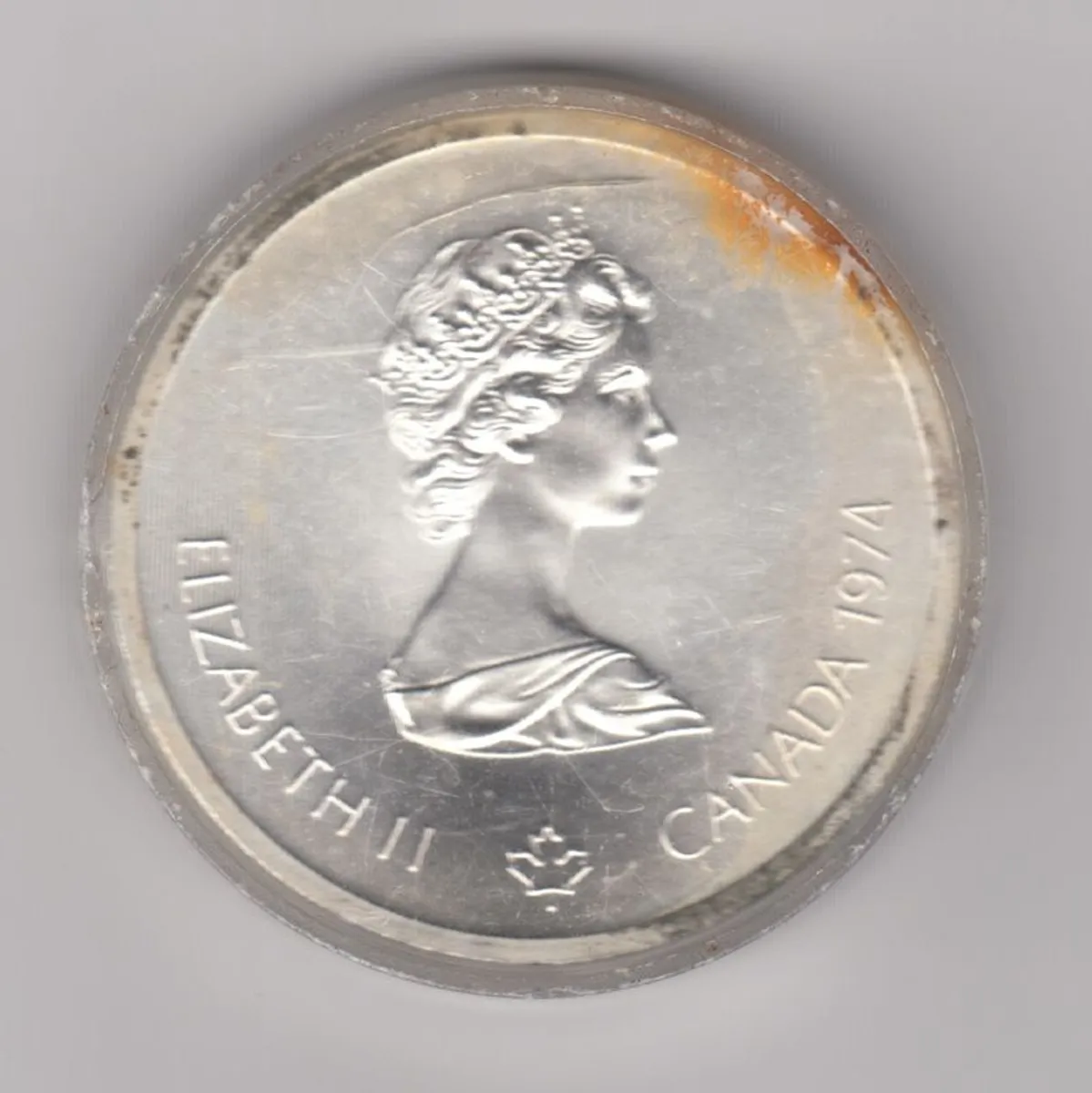 Canada, 1976 Montreal 10 Dollar Olympic Silver Coin, Lacrosse Player 921/2% silver in capsule  note orange colour - Image 2