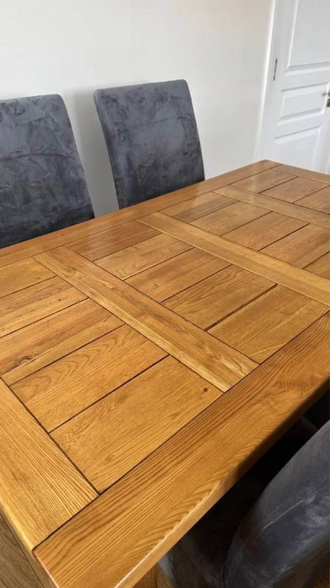 Solid Oak extendable dining room table and four chairs - Image 2