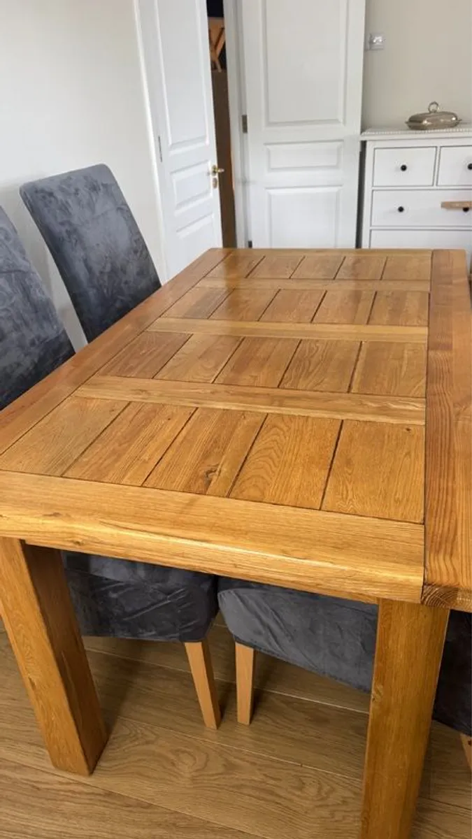 Solid Oak extendable dining room table and four chairs - Image 3