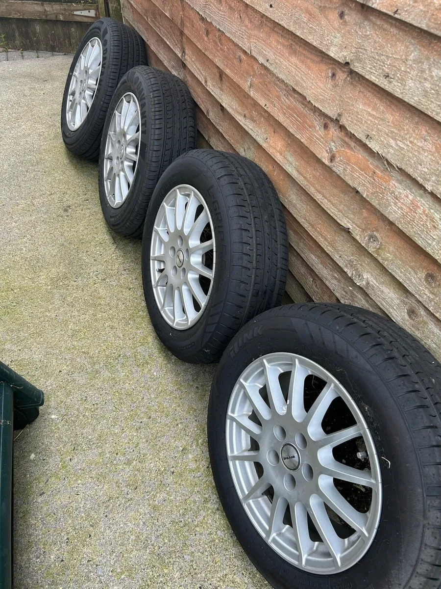 14” Alloys, brand new tires - Image 2