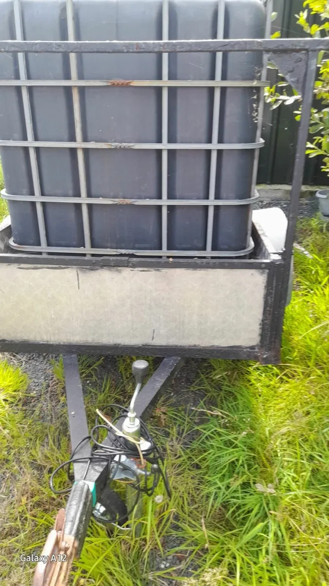 Trailer and Large Plastic Container