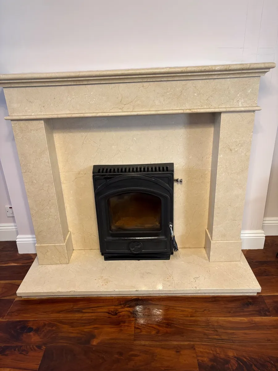 A cream marble fireplace and Stanley insert stove - Image 2