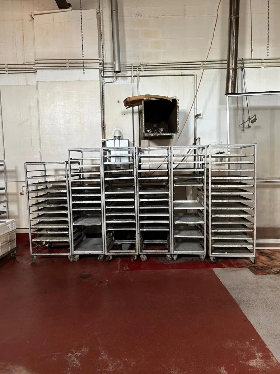 Six baking tray trolleys and trays