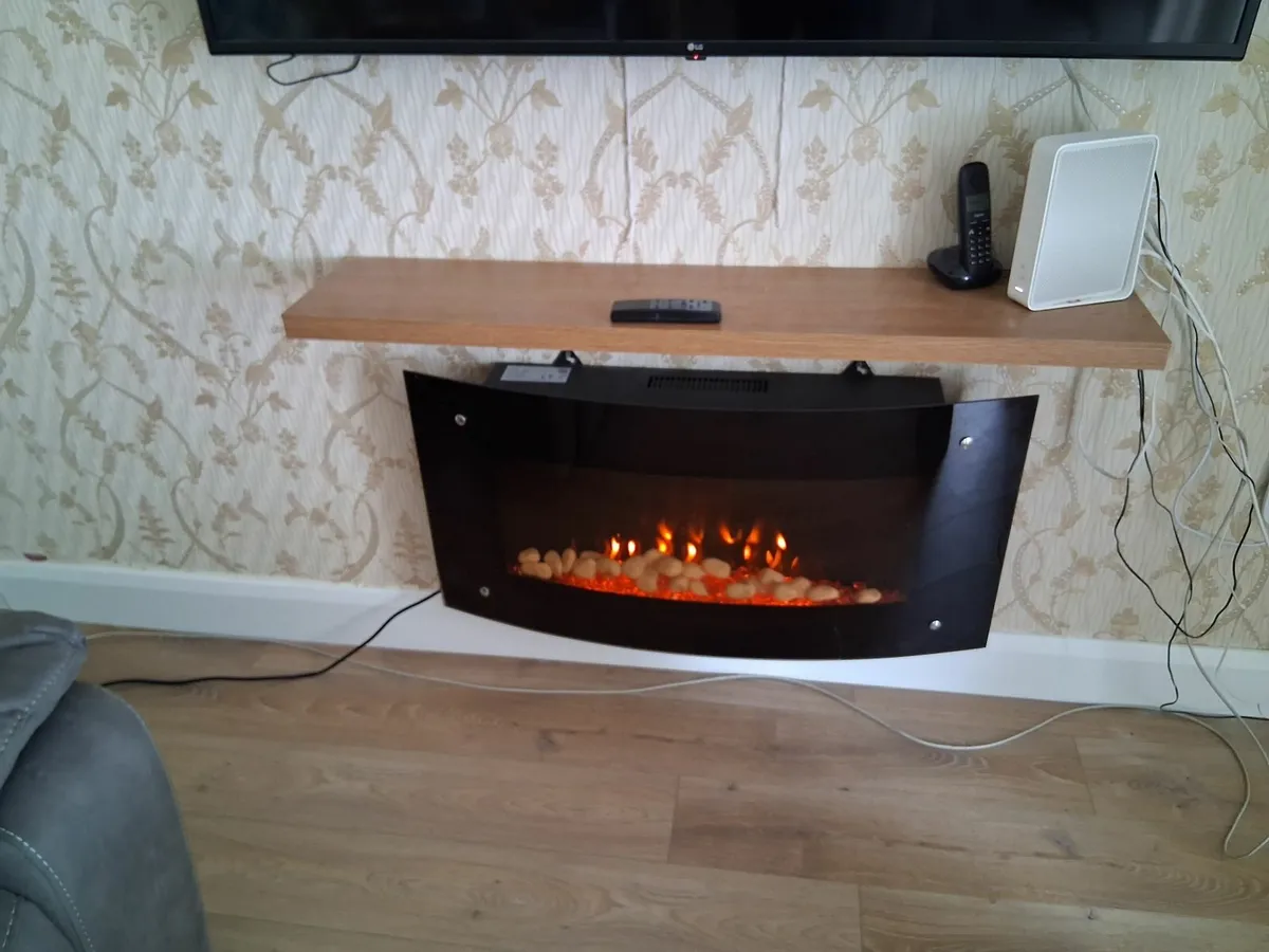 A wall hung electric fire with remote controls (2) - Image 1