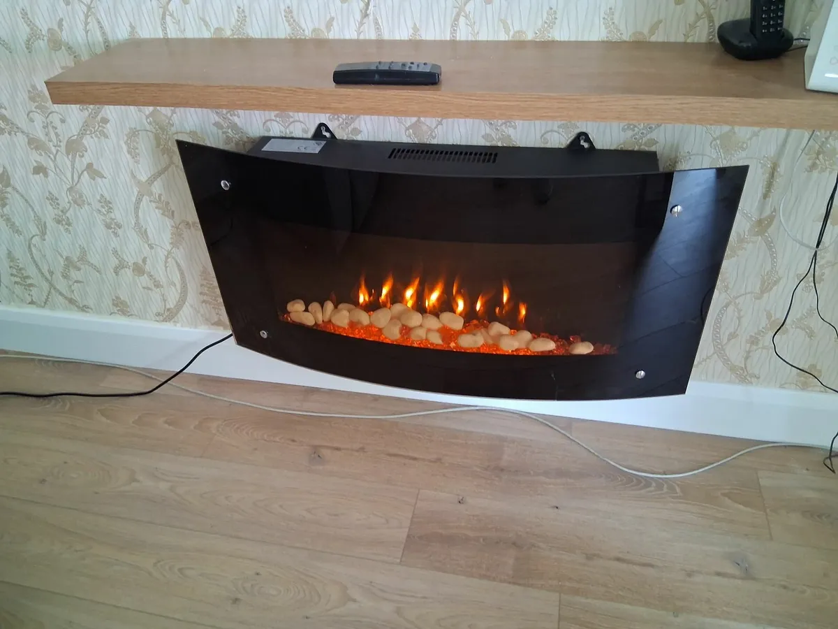 A wall hung electric fire with remote controls (2) - Image 2