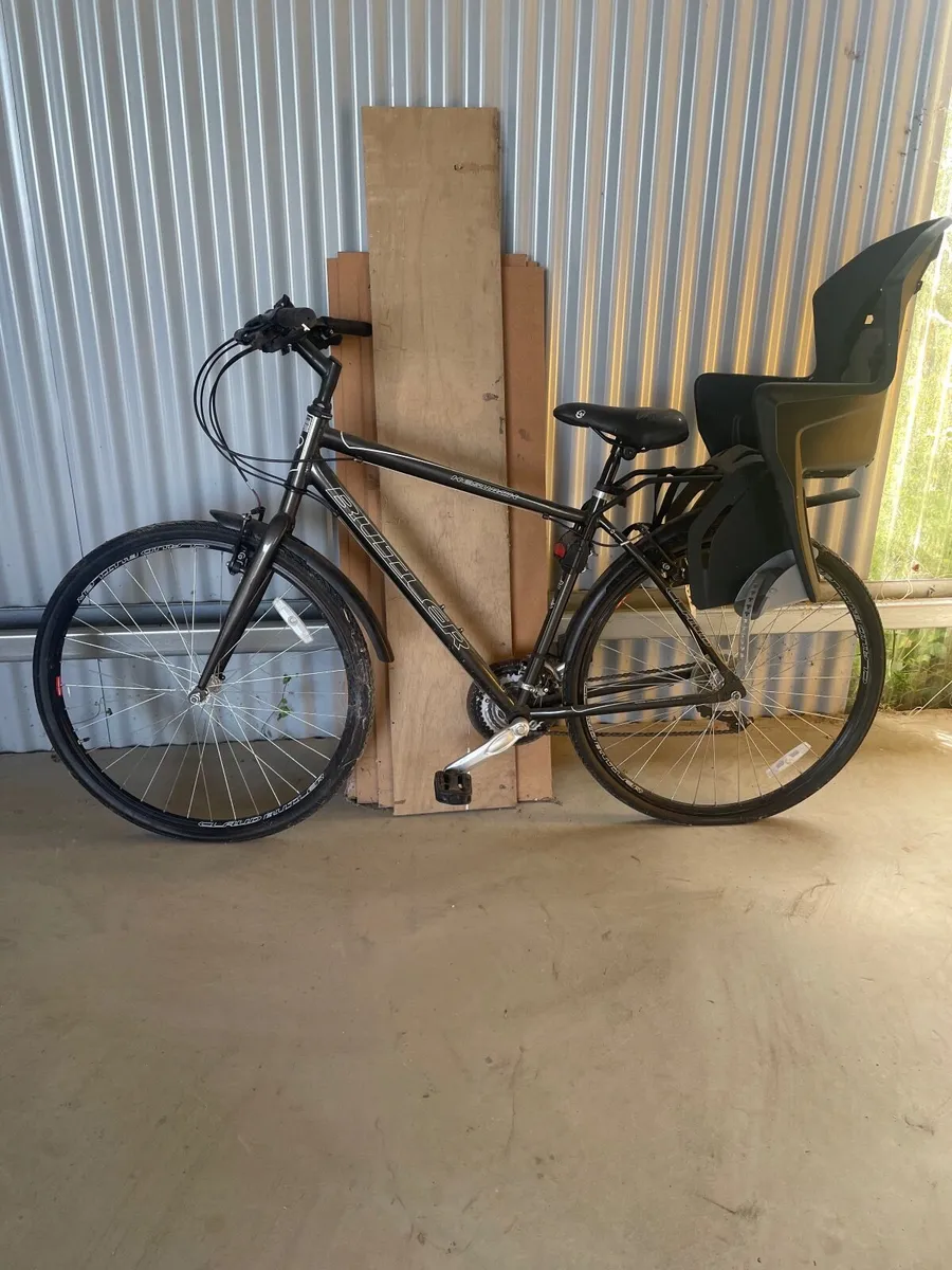 Bicycle with child seat - Image 1