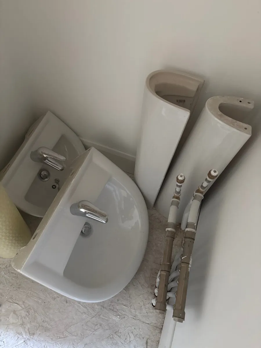 Bathroom sink and pedestals