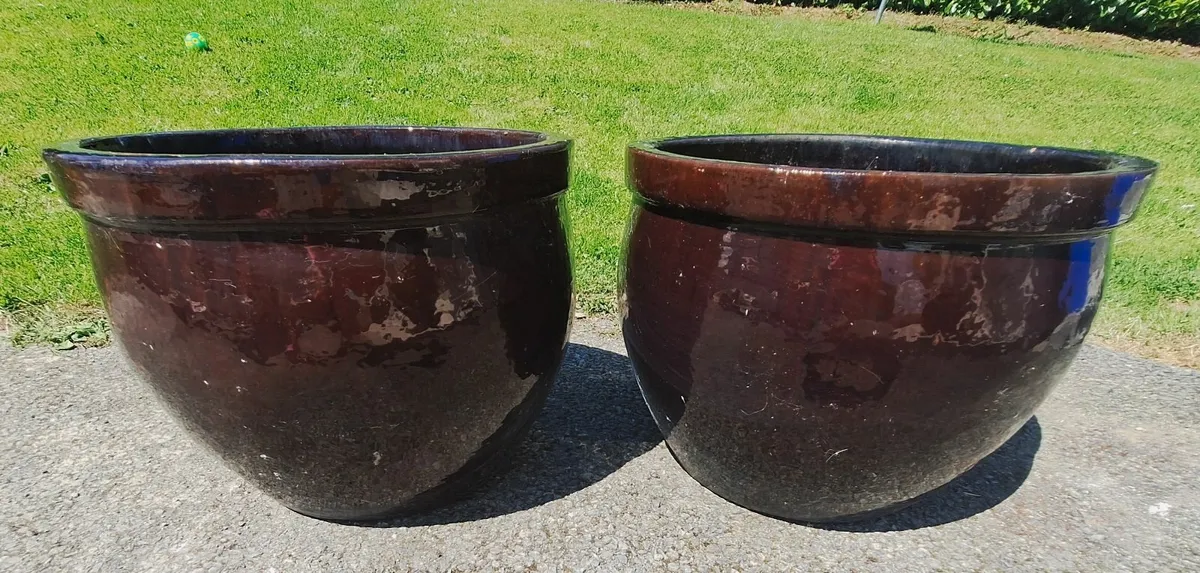 Two brown large ceramic pots