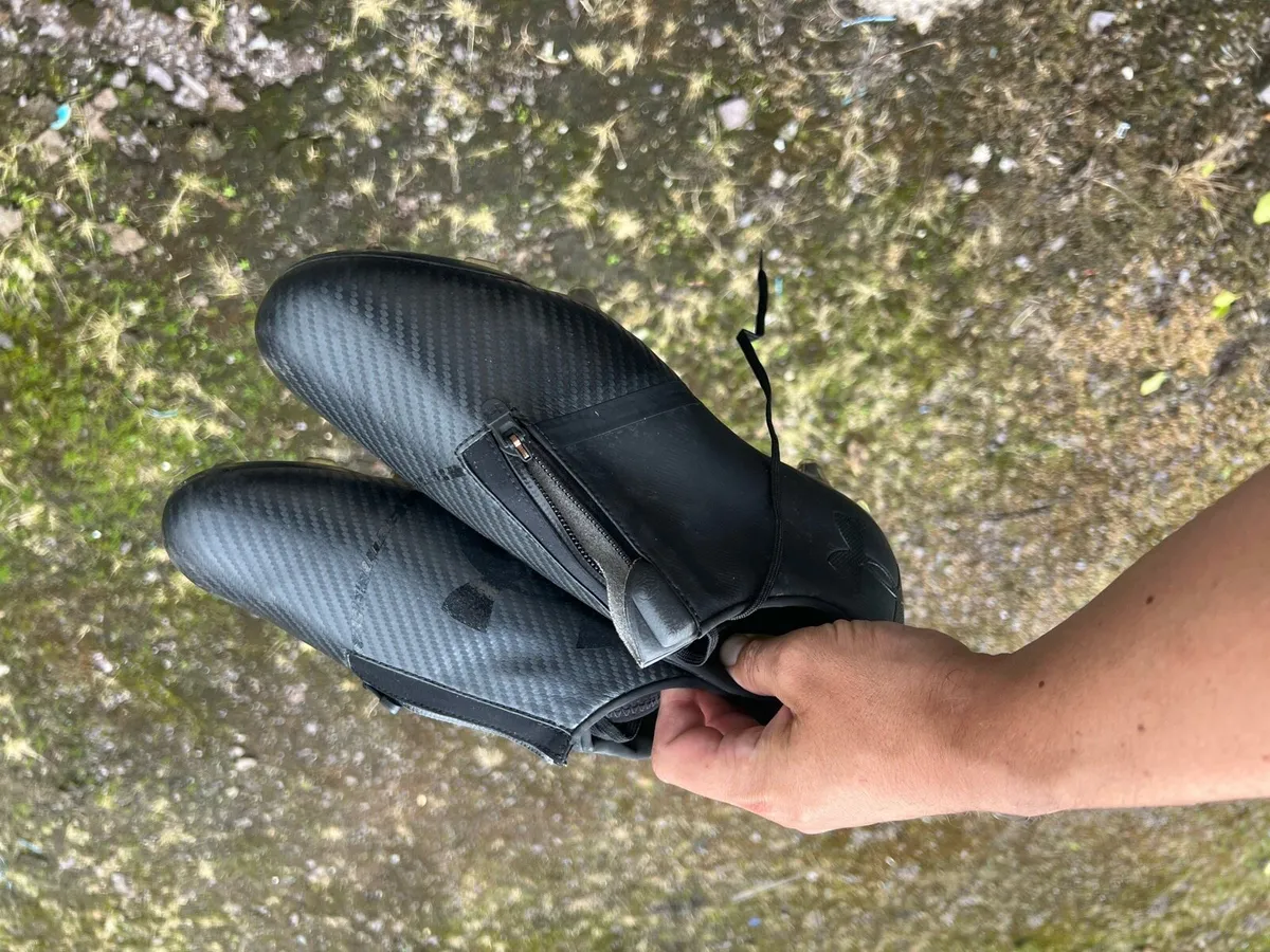 Two pairs of football boots one new - Image 1