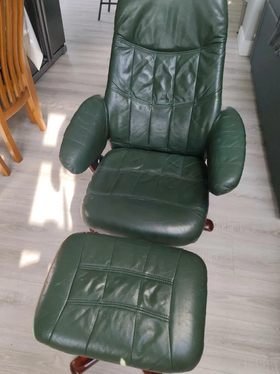 Green leather lounge chair and footstool - Image 1