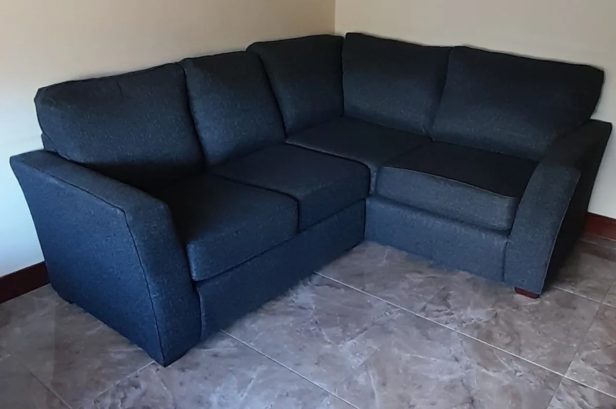 Black corner sofa and footstool. - Image 1