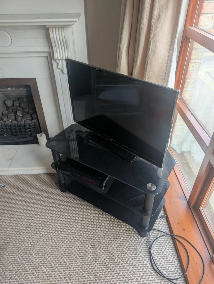 32" JVC LED Smart TV with tv stand and saor box - Image 1