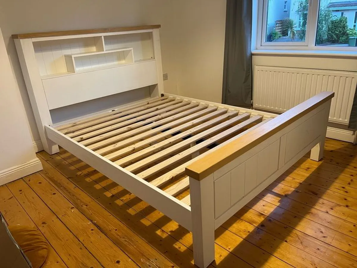 King size bed frame with shelving in headboard