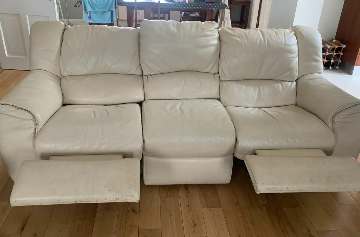 Two  beige three seater  leather reclining Sofas - Image 1