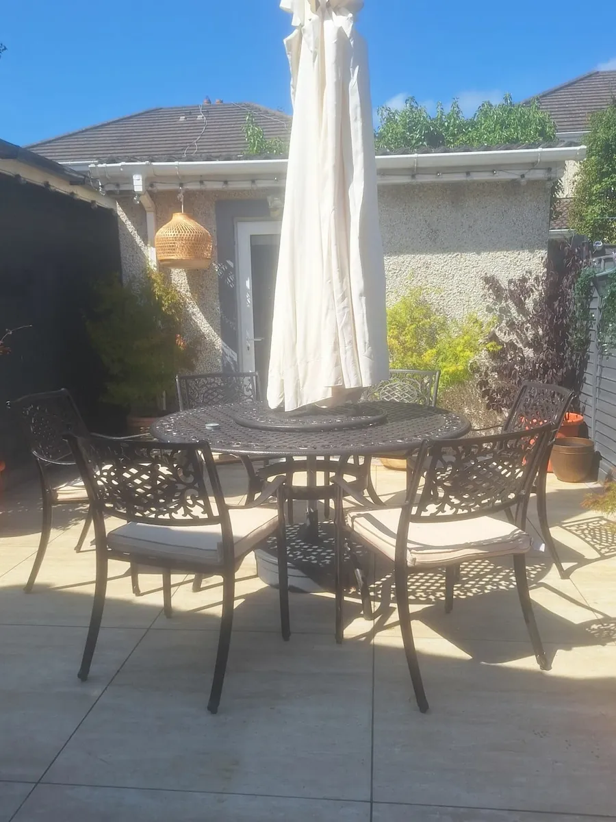 Rathwood wrought iron garden table and 6 chairs - Image 1