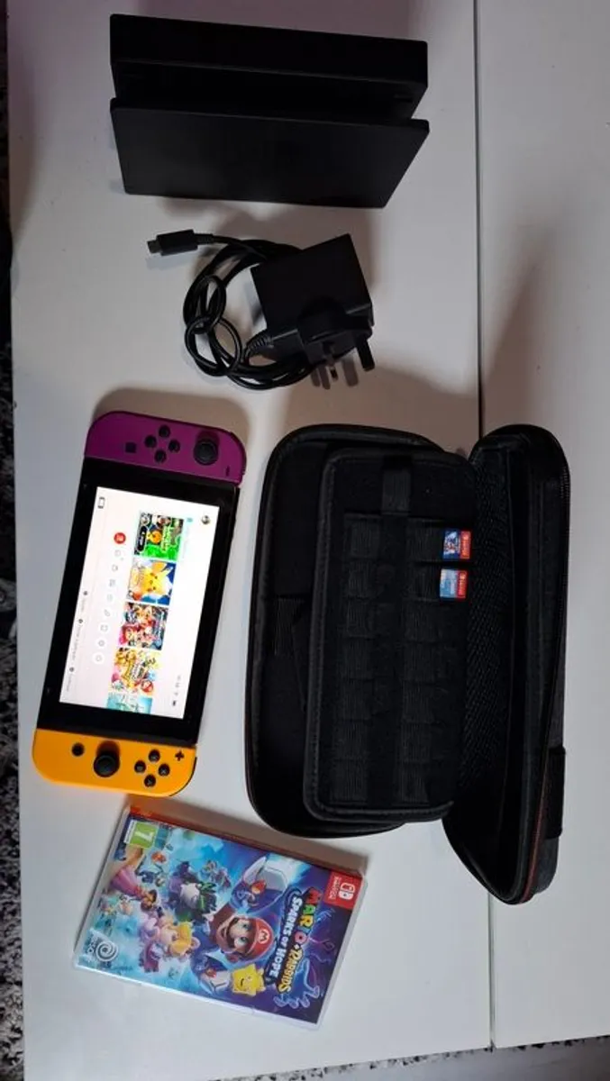 Nintendo Switch - Neon Purple/Orange - Image 1