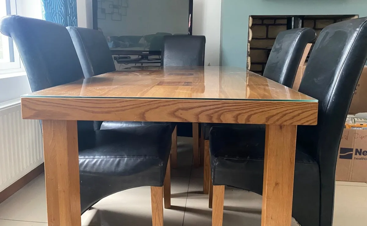 Solid wood table with glass top 8 chairs - Image 1